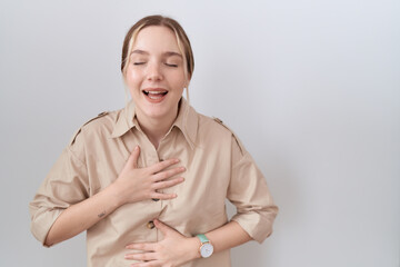 Poster - Young caucasian woman wearing casual shirt smiling and laughing hard out loud because funny crazy joke with hands on body.