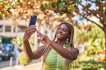 Sticker - African american woman smiling confident making selfie by the smartphone at park