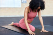 © Flamingo Images - Fit woman doing yoga at the gym