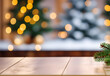 Abstract blur Christmas tree with bokeh light adornment on an empty wooden table top