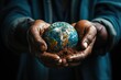 An image featuring the Earth cradled in a pair of gentle, mending hands, symbolizing the collective responsibility and care needed to repair the planet
