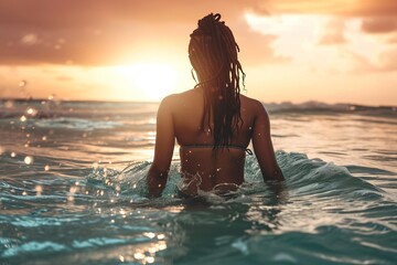 Wall Mural - young black woman having a bath on the water of a relaxing tropical sea 