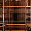 Well organized wine cellar with plenty of wooden shelves