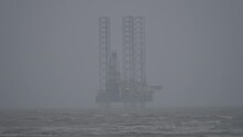 Gas Rig Situated Off Ainsdale Beach On Cloudy And Stormy Day