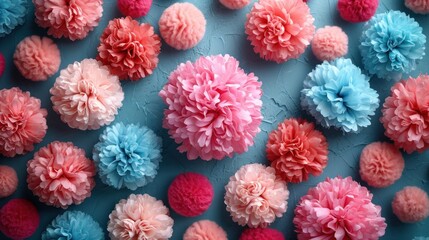 Sticker -  a group of pink and blue pom - poms on a blue surface with other pom - poms.