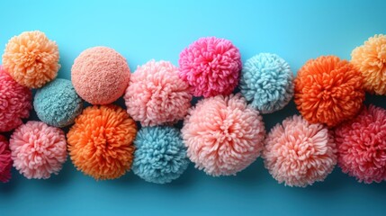 Sticker -  a group of multicolored pom - pom balls sitting on top of each other on a blue surface.