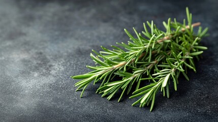 Sticker -  a close up of a sprig of rosemary on a black surface with a green stem sticking out of the top of the sprig.