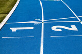 Fototapeta  - Blue treadmill for running in the stadium