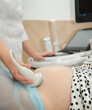 © liubovyashkir - Ultrasound scan of pregnant woman In hospital, doctor performs an ultrasound sonogram on pregnant woman.