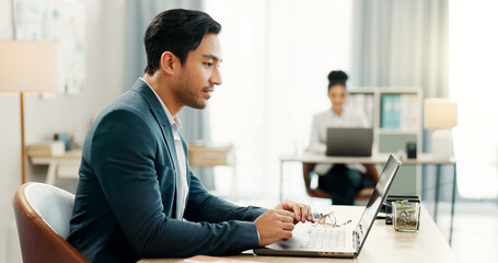 Poster - Man at desk, laptop and typing in coworking space, market research and online schedule at consulting agency. Office, admin and happy businessman at computer writing email review, feedback or report.