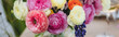 Bouquet of fresh bright colourful ranunculi flowers in a glass vase. Floral wedding decor. Banner