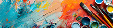 Vibrant Art Supplies With Paint Brushes And Colorful Strokes On Canvas