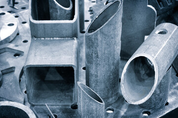 Poster - cut metal parts as industrial metalworking concept background