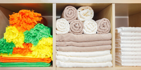 Leinwandbilder - Multi-colored towels on a shelf in a store