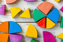 Colorful Math Fractions On The Wooden Background. Interesting Math For Kids, For Preschool, Daytime. Education, Back To School Concept. Geometry And Mathematics Materials. AI Generated	