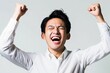 © Maki_Japan - ガッツポーズをして喜ぶ日本人の男性ビジネスマンマンのポートレート（白背景・会社員・スーツ・新入社員・プレゼン・勝利）