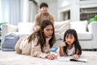 © Art_Photo - Portrait happy love asian family mother teach little daughter asian girl learn and study.Mom and asian young girl reading book and pencil making lessons in homeschool at home.Education.