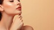 © buraratn - side view of cropped woman with perfect skin touching chin isolated on beige