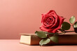 Red rose flower on a book with light red copy space. Valentine's Day and love concept