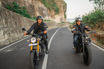 Sticker - indonesian men enjoying riding motorcycle outdoors, motorcycle adventure concept