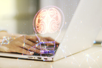Poster - Creative light bulb with human brain hologram and with hands typing on computer keyboard on background, artificial Intelligence and neural networks concept. Multiexposure