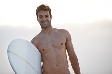 Poster - Fitness, portrait and happy man at a beach with surfboard for wellness, sports and training in nature. Water, exercise and face of male surfer at the ocean for morning cardio, freedom and travel