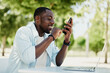 © SHOTPRIME STUDIO - Phone man young mobile guy smartphone lifestyle adult technology african smart person male black