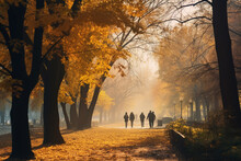 Foggy Autumn Morning In City Park With Pedestrians.