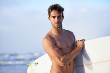 Canvas Print - Beach, surfing and portrait of man with surfboard for, waves on summer vacation, weekend and holiday by sea. Travel, nature and face of person by ocean for water sports, adventure or fun in Australia