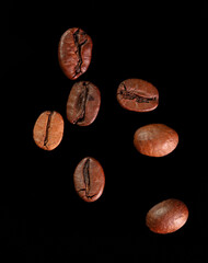 Wall Mural - Coffee beans isolated on black background. Close-up