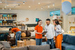 © Odua Images - couple customer man and woman chatting with a woman store employee looking at a tablet in furniture department store