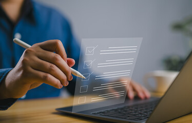 Poster - Business performance checklist concept, filling out digital form checklist. Businessman using laptop doing online checklist survey..