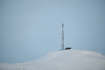 Sticker - Antenna mast on snowy mountain top in winter