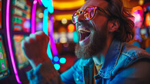 Portrait Of A Happy Gambler Win Money In In Casino Playing At Slot Machines