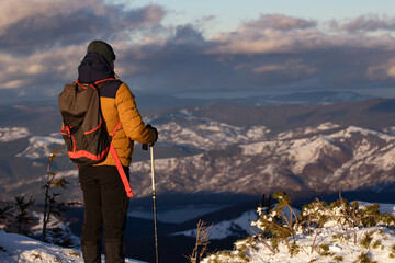 Wall Mural - Hiker in a wintry mountain landscape