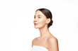© Beauty Agent Studio - Full face profile beauty portrait of young beautiful woman with a clean glowing skin brown hair with a bun hairstyle wear white top with off shoulders isolated on white background