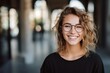 Close up portrait of a young smart caucasian woman female student teenager wearing glasses walking in city outdoors in summer