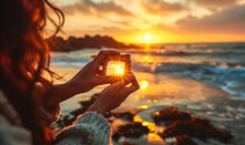 Creative Traveler Framing The Setting Sun With Fingers On A Beach, Capturing The Essence Of Wanderlust And Destination Dreaming