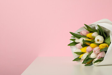 Wall Mural - A bouquet of fresh tulips on a light background