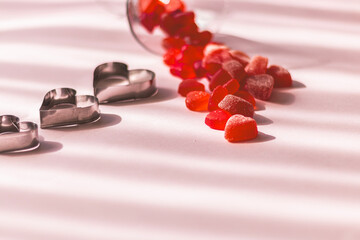 Valentine's day concept with red hearts and candies on wooden table