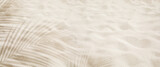 Selective focus of summer and holiday  backgrounds concepts with shadow of coconut leaf on clean sand beach