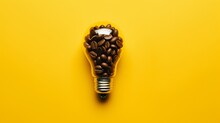 Caffeine Creativity: Illuminating Concepts With A Coffee Bean Light Bulb On Vibrant Yellow Background - Good Ideas Start With Great Coffee