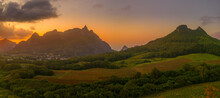 View Of Golden Sunset Behind Long Mountain And Patchwork Of Green Fields, Mauritius
