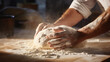 Pizzaiolo's hand kneading dough