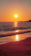 Wall Mural - Sunset sky over sea in the evening with colorful clouds and warm sunlight.