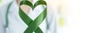 banner, copyspace, World Bipolar Day, heart-shaped green ribbon, symbol of hope and solidarity for mental health awareness, wellness programs, patient support.