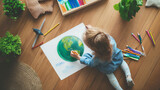 Fototapeta  - Criança desenhando o planeta terra visto de cima 