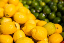 Piles Of Lemons And Limes For Sale At The Markets