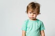 © Anastasiia - Mockup Of A Young Boy Wearing A Green T-Shirt Against A White Background