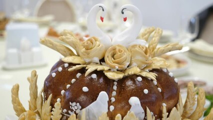 Wall Mural - The wedding cake is decorated with white swans